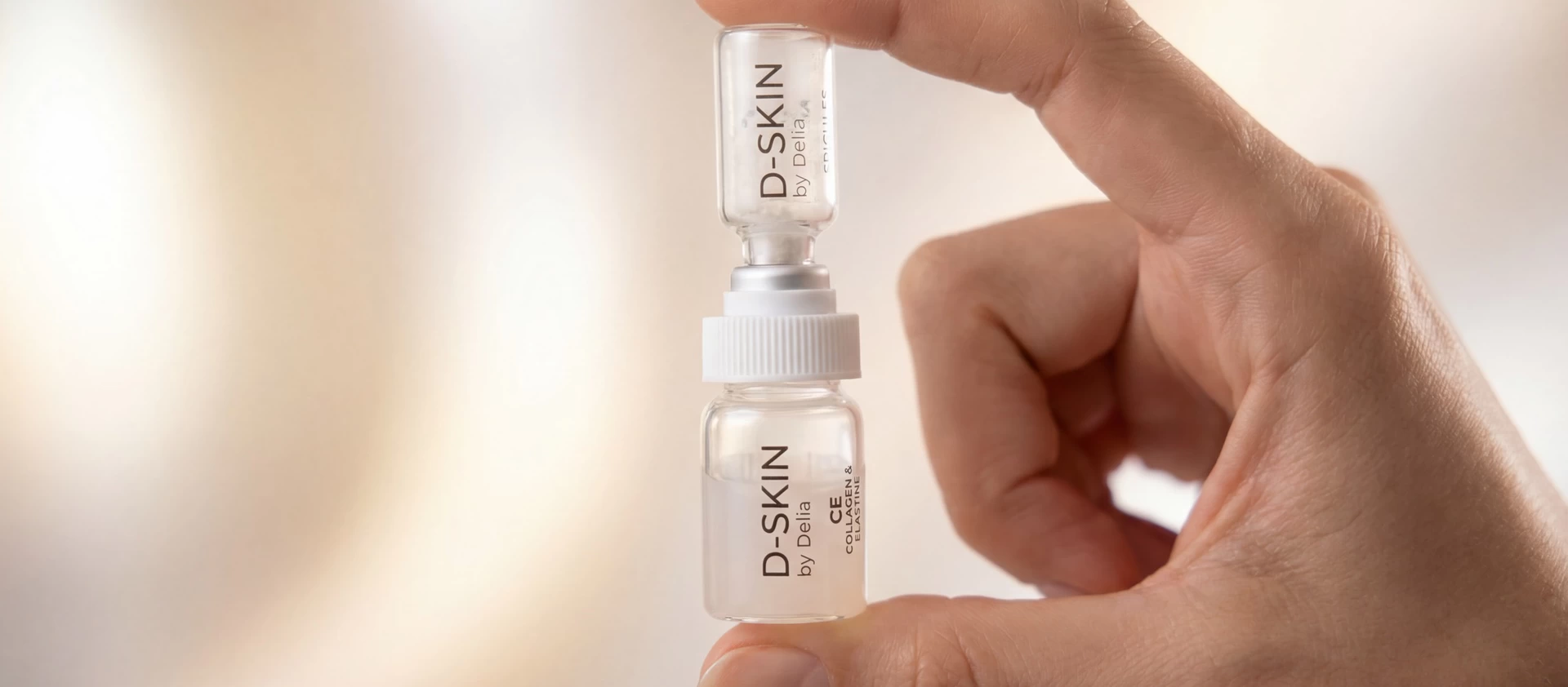 D-SKIN Synergy System vial held in hand
